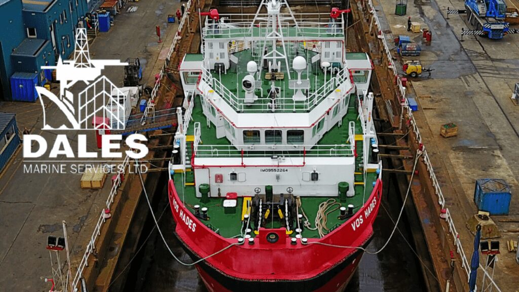 Marine vessel undergoing maintenance in dry dock for inspection and repairs.