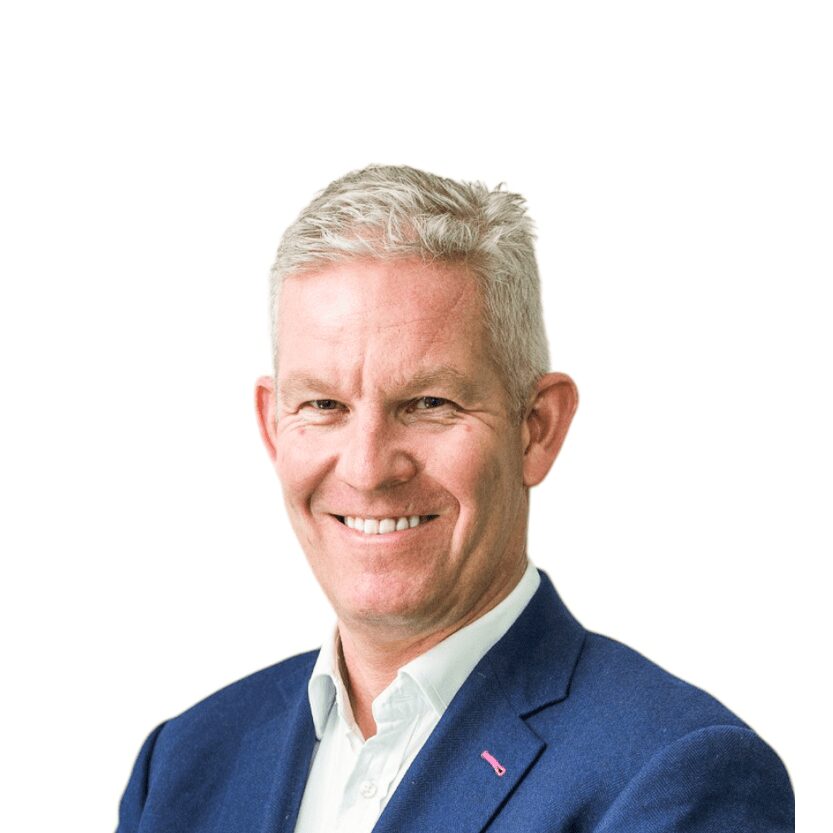 Professional businessman in a blue suit smiling for the camera.