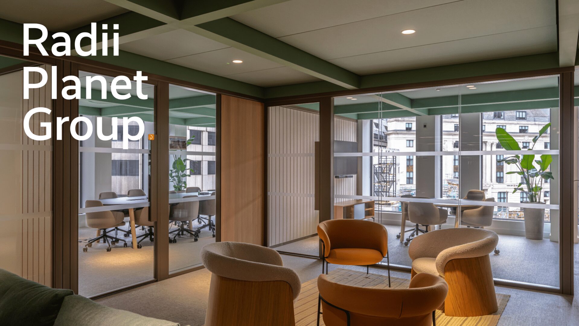 Modern office space with meeting areas and large windows.